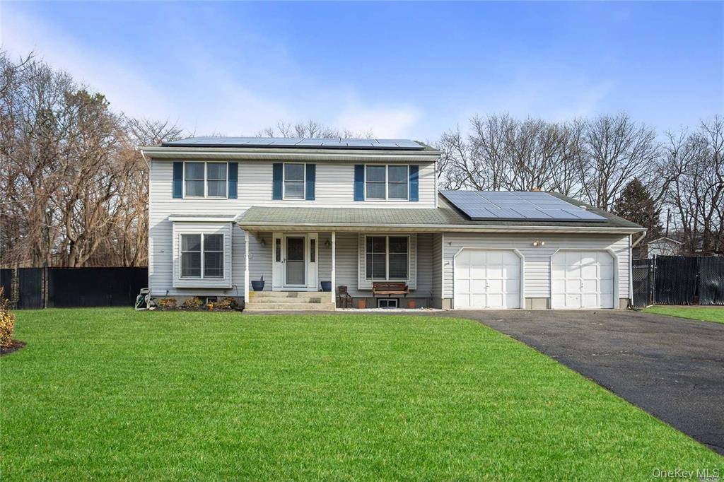 This sprawling four bedroom, three full bath Colonial is located in the desirable Sachem School district.