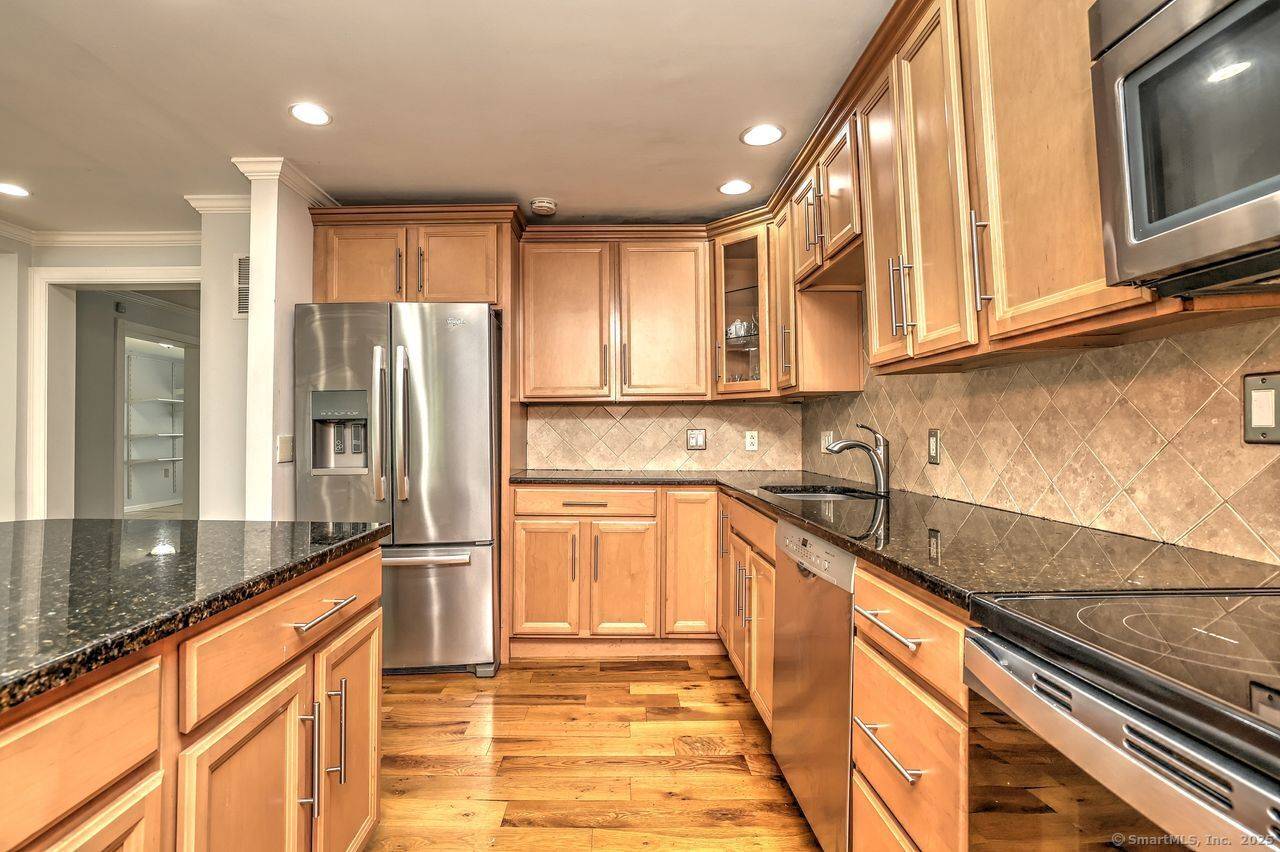 Circular driveway leads to this Mount Carmel Oasis beautifully situated on a private, wooded 1.