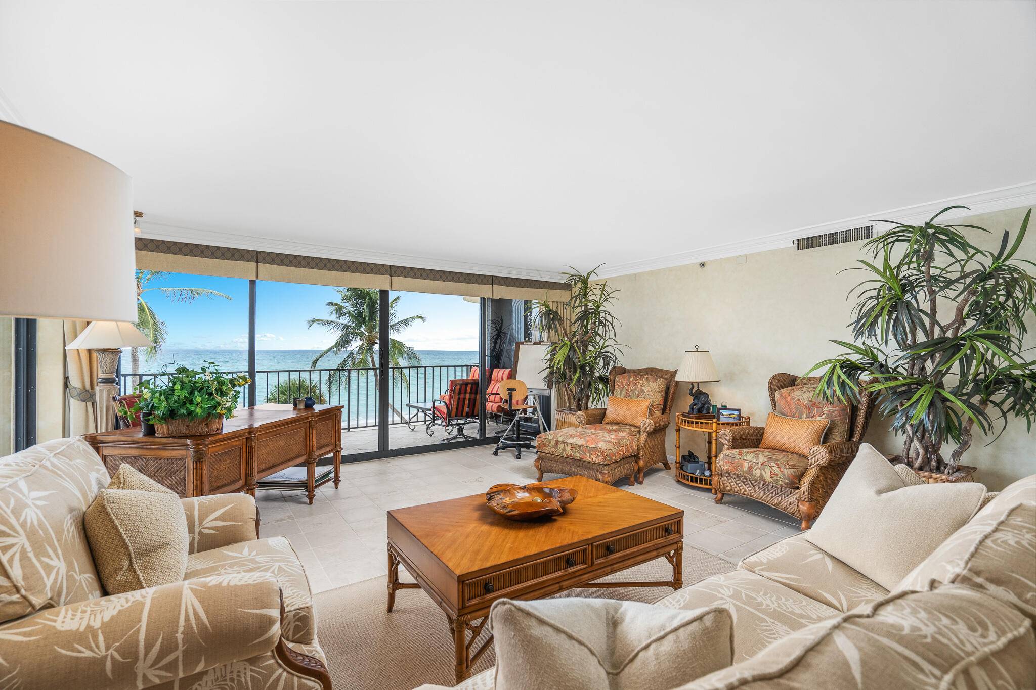 This corner residence is filled with natural sunlight and features a wraparound balcony, perfect for enjoying panoramic ocean views.