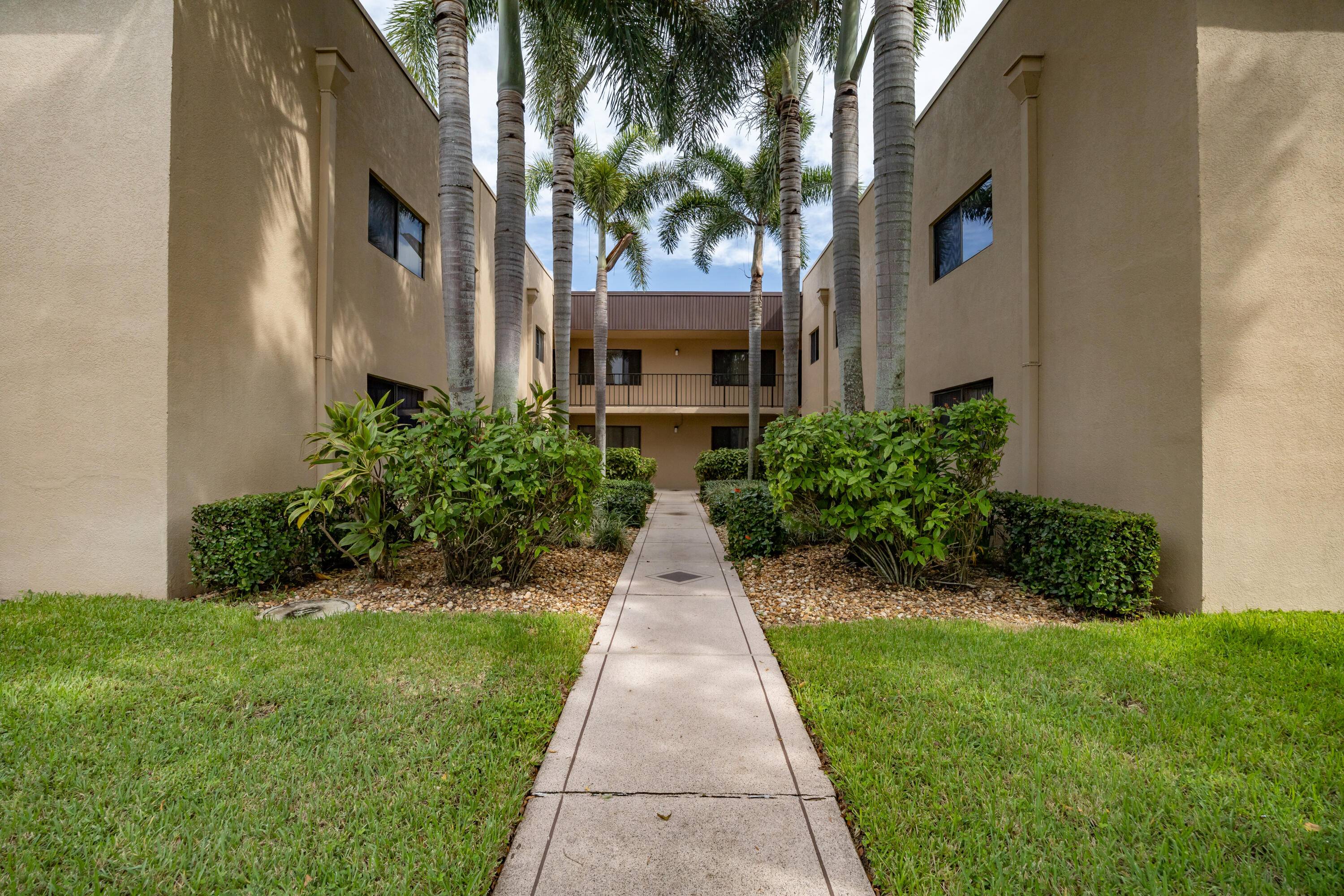Absolutely beautiful first floor 2 bedroom 2 bathrooms renovated condo with serene lake views in a popular 55 community Lakes of Delray.