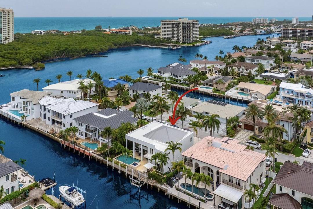 Experience the pinnacle of South Florida living in this fully furnished, turnkey modern estate located just two lots from the point on a deep water canal with 85 feet of ...