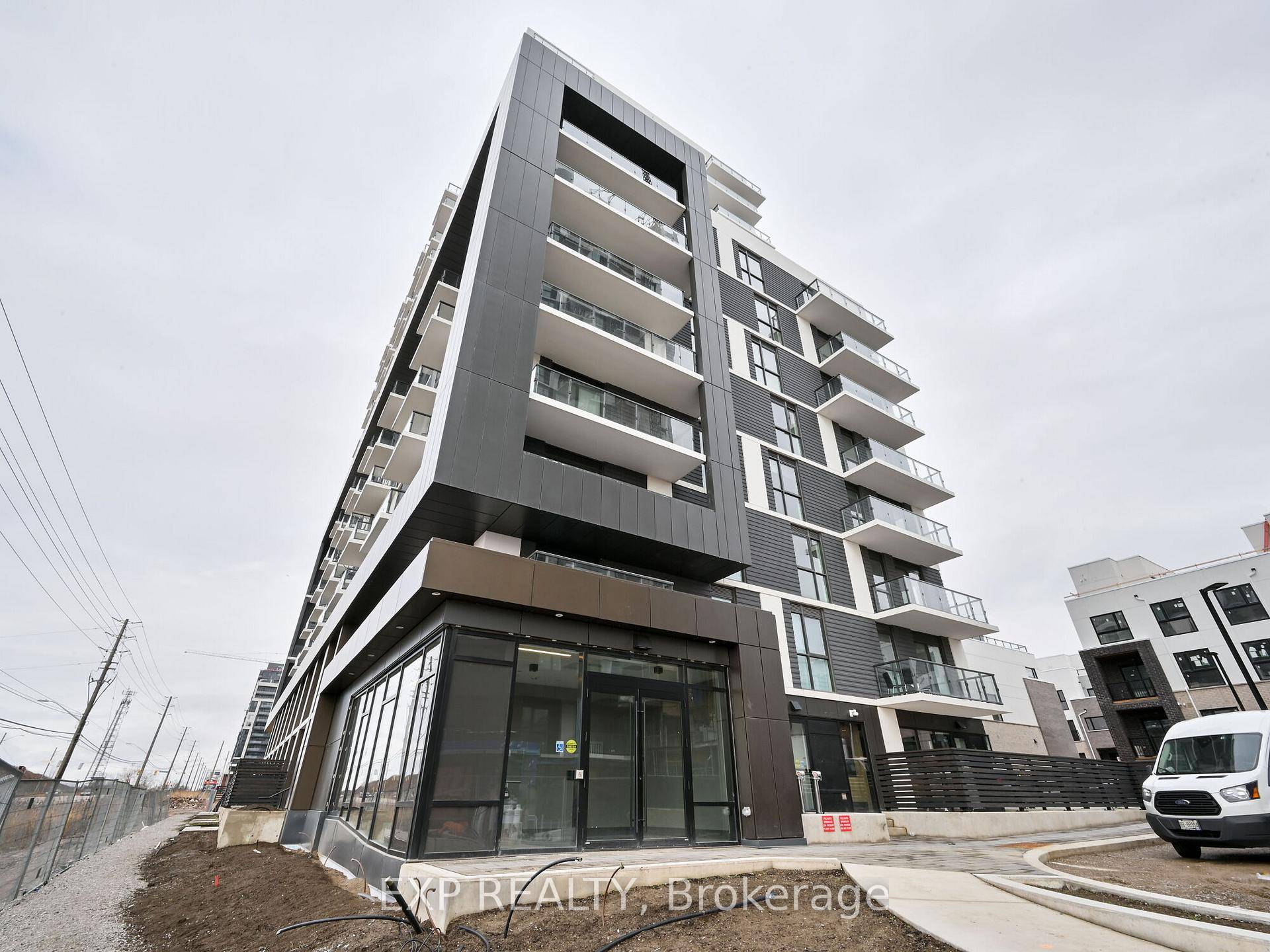 Bright and Spacious Condo featuring 9 ft ceilings, Modern Laminate Flooring, and an Open Concept Living Dining area with Walk Out to Balcony.