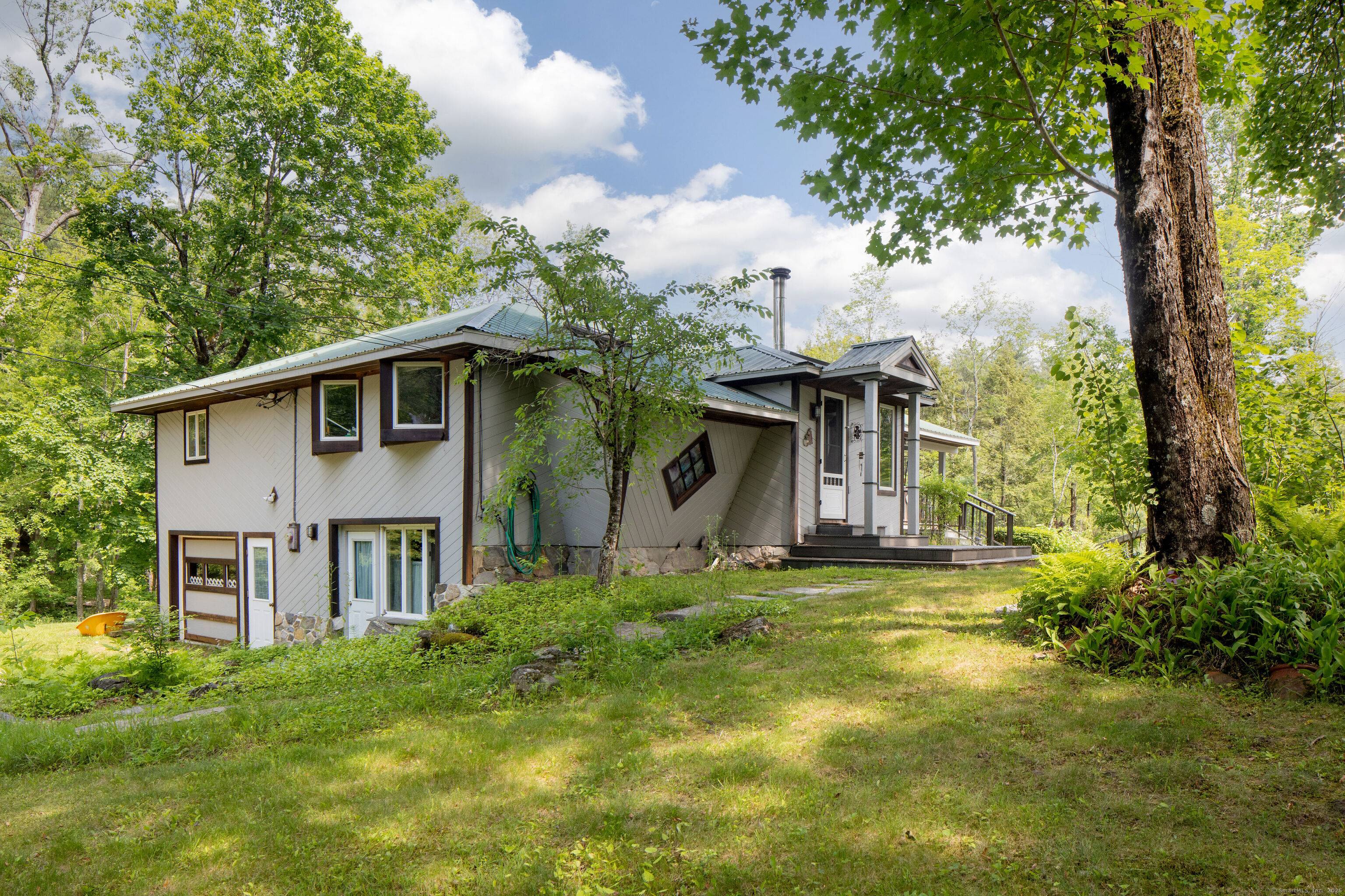 Tucked away on a private road with shared lake access to the serene waters of Lake Washinee, this custom one level home offers the perfect blend of natural beauty, thoughtful ...