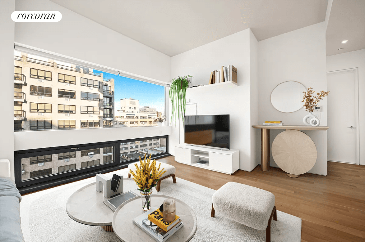 Amazing, sun flooded one bedroom with 10 foot ceilings, solid oak wide plank floors, in unit washer dryer, central A C and 11 foot wide triple paned windows.