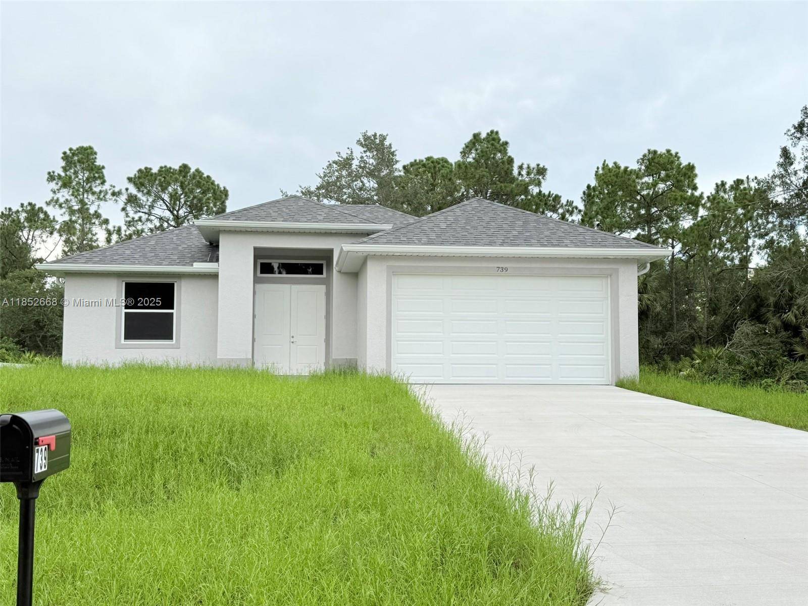 Stunning new construction 3BR, 2BA home with double garage and lanai in prime East Lehigh.