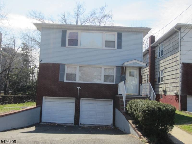 Well maintained 2Fam house features large rooms, renovated 1st floor, 3BRs each floor, central A C, finished basement w full bath, separate gas heat.