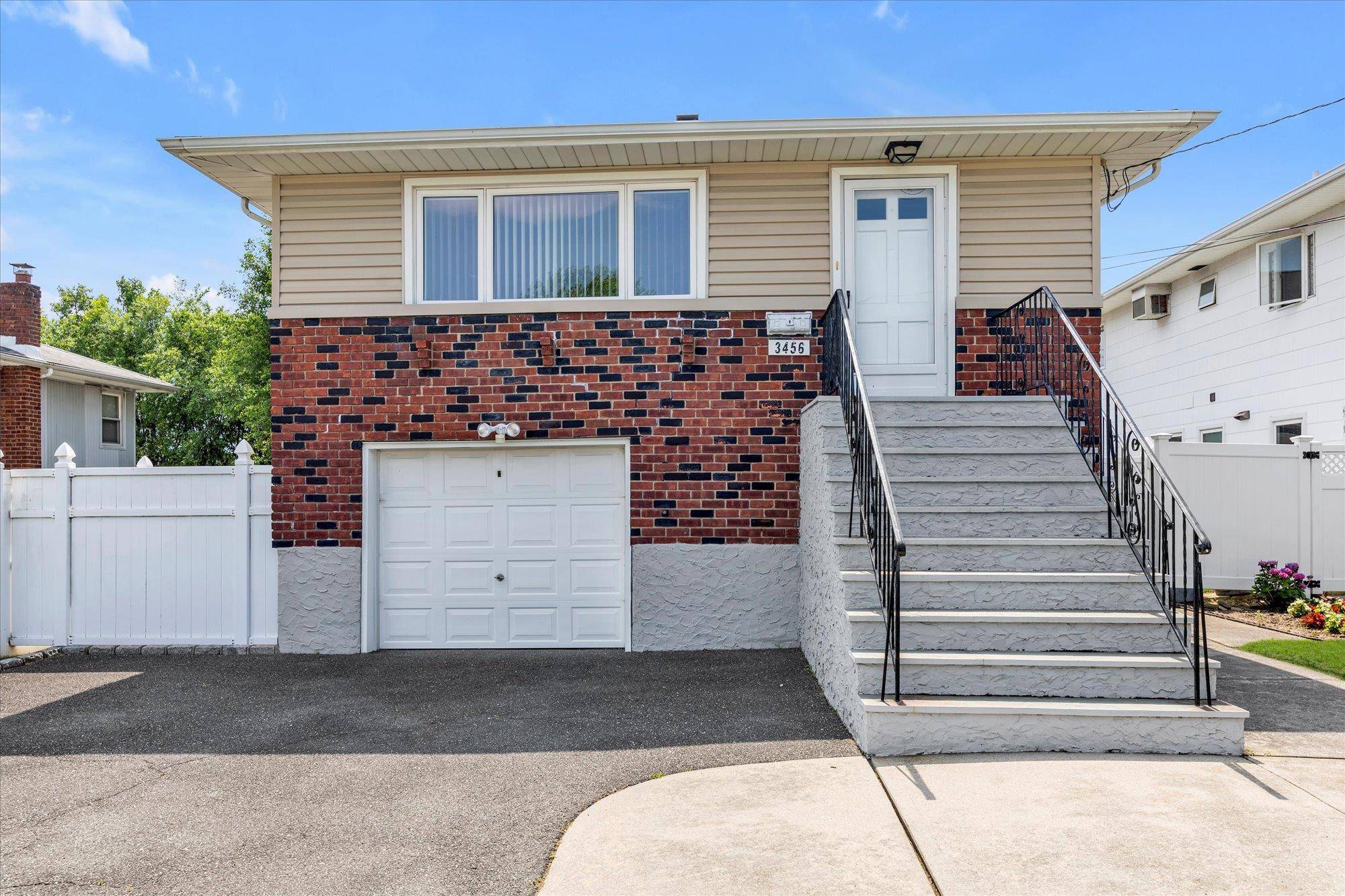 Oceanside Hi Ranch featuring 3 bedrooms on a tree lined street.