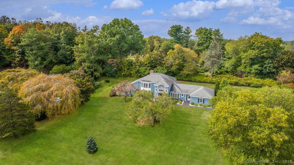 Sprawling Contemporary fully renovated and nestled within the Pine Orchard Association ; set back on a large corner lot.