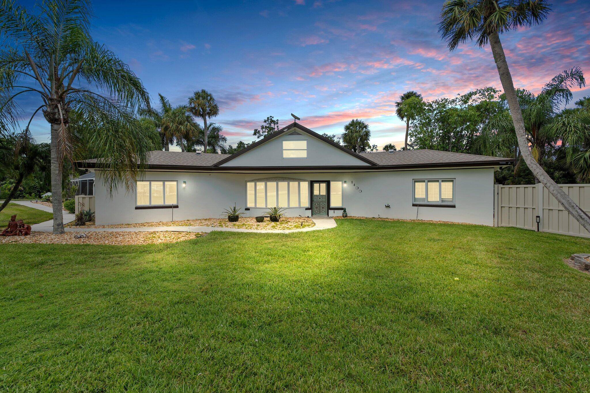 Rare waterfront retreat on nearly 2 private acres with 142 ft on the St.