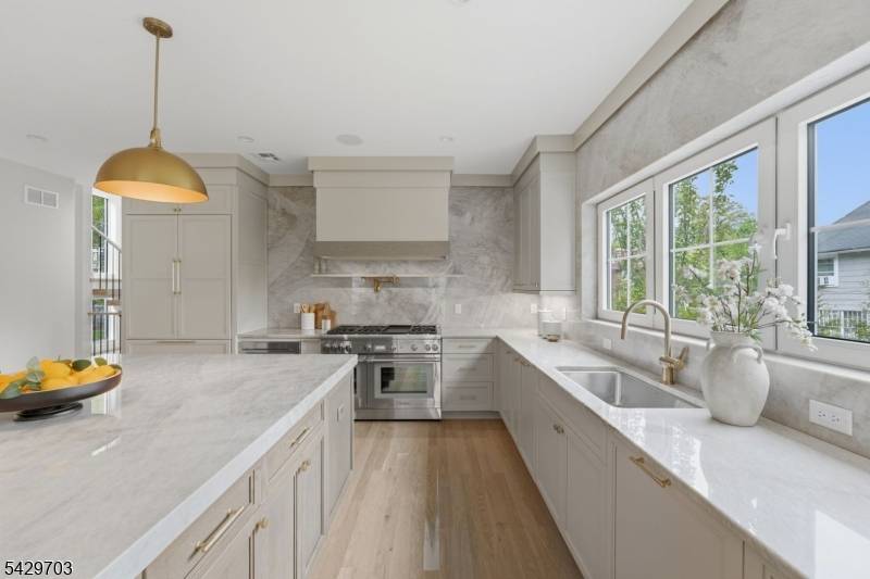 Experience the pinnacle of luxury in this new construction masterpiece by Singer Properties.