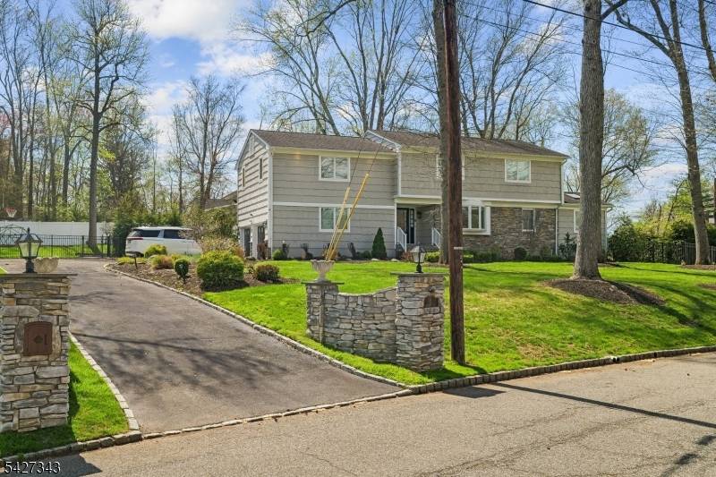 Nestled atop a beautiful corner lot in a much sought after neighborhood this stunning 4 bedroom, 3 1 2 bath Colonial blends luxury and convenience for today's lifestyle greeted by ...