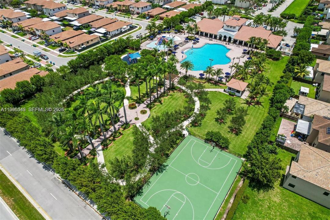 This home features four bedrooms with wood flooring and two full bathrooms upstairs, including a primary suite with a beautiful heart shaped jacuzzi tub.