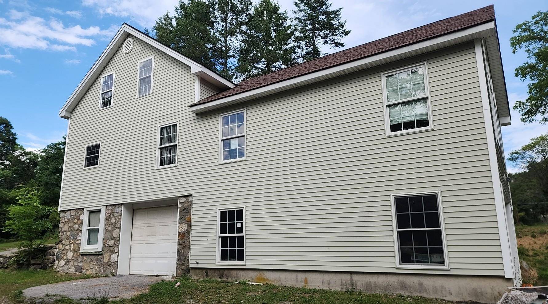 Sitting on over an acre of land is a 6 room, 2 bedroom, 2 bath home with a garage.