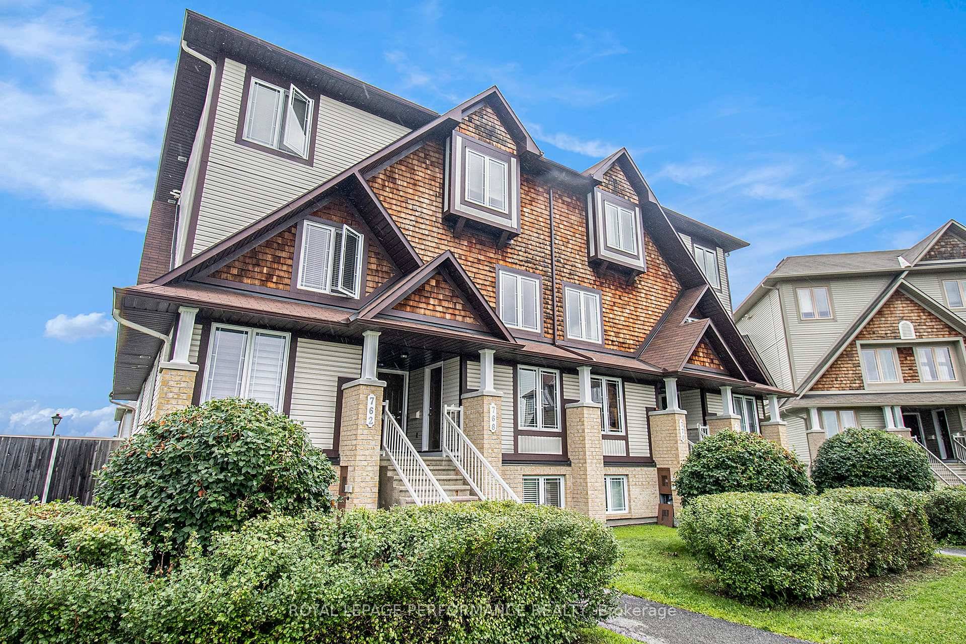Upper level terrace home with two parking spots.