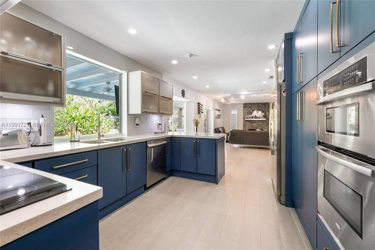 Completely remodeled Pinecrest home with summer kitchen by the pool !