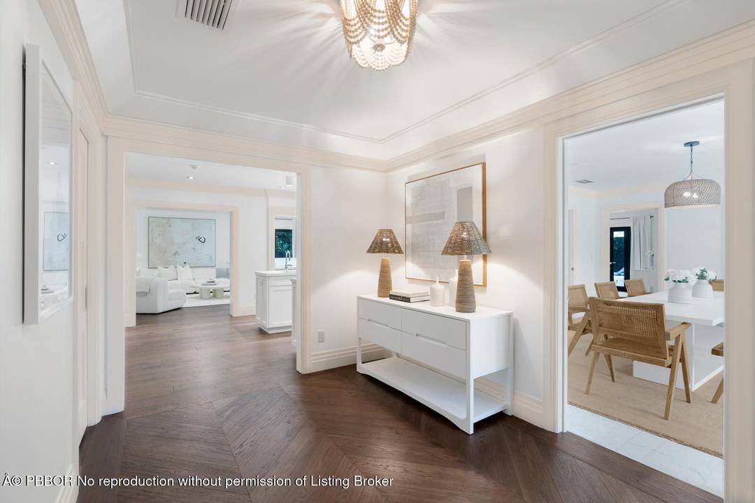 Located on a quiet street in Palm Beach's North End, this modern beach house offers 3, 803 total square feet with four bedrooms and four and a half bathrooms.