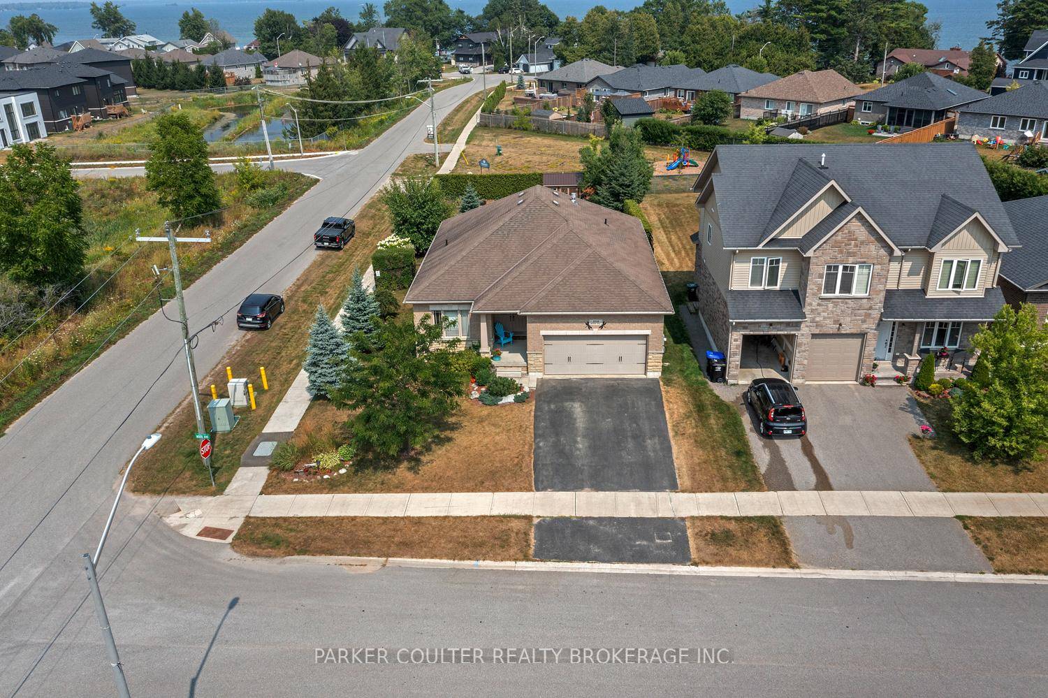 Charming all brick raised Bungalow on corner lot with deeded access to waterfront with dock !