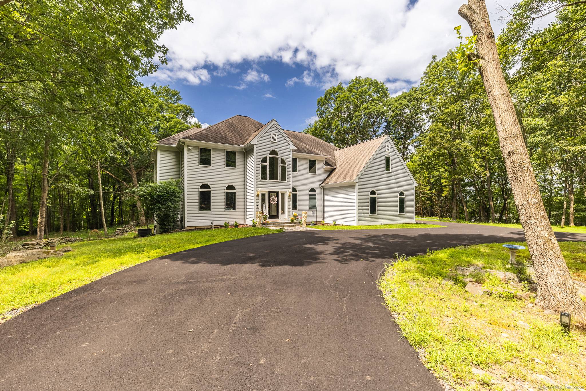 Exceptional Custom Colonial in Prestigious Quaker Farms Neighborhood.
