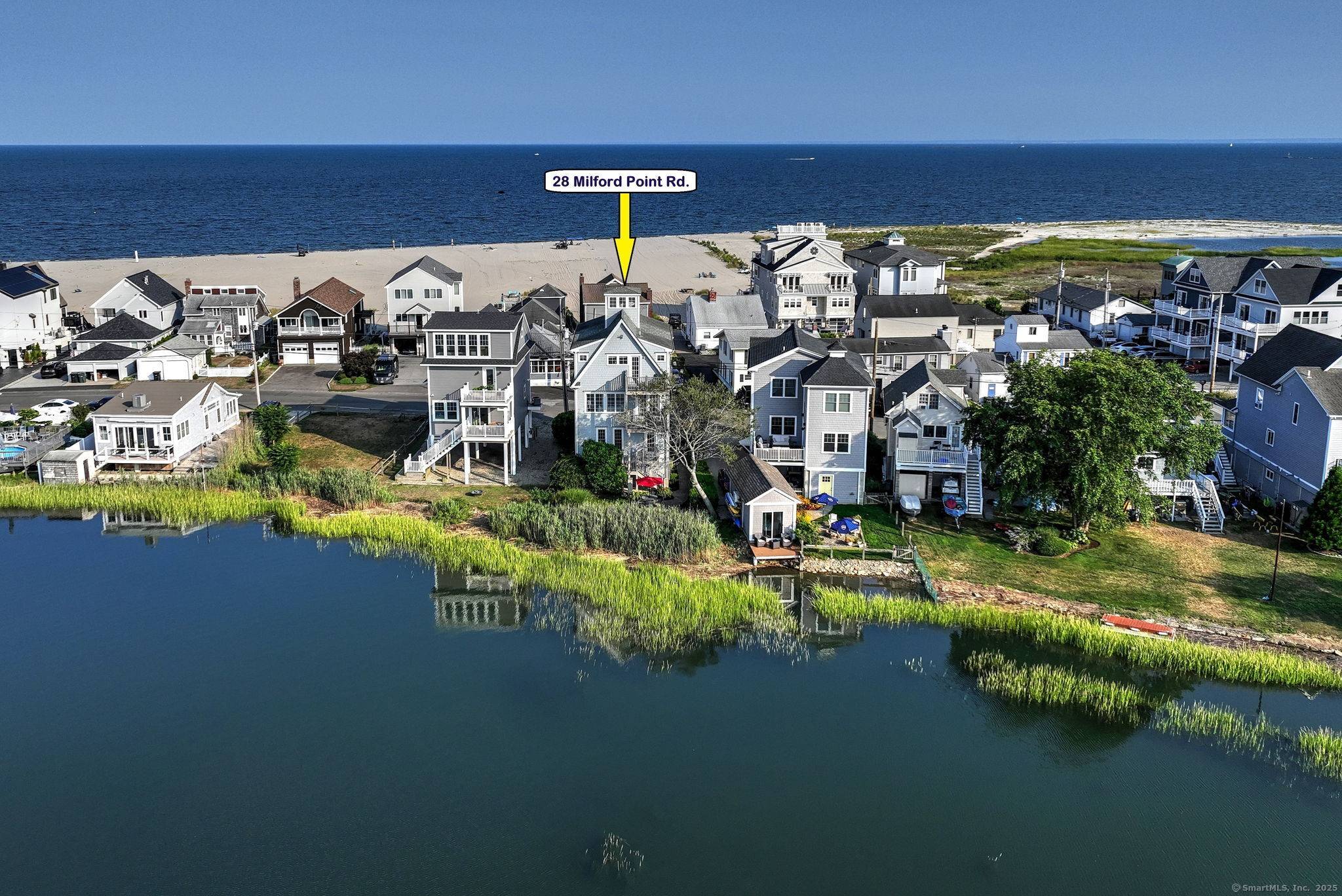 DIRECT WATERFRONT CEDAR BEACH, MILFORD Welcome to an exceptional opportunity to live by the water in comfort, style, and tranquility.