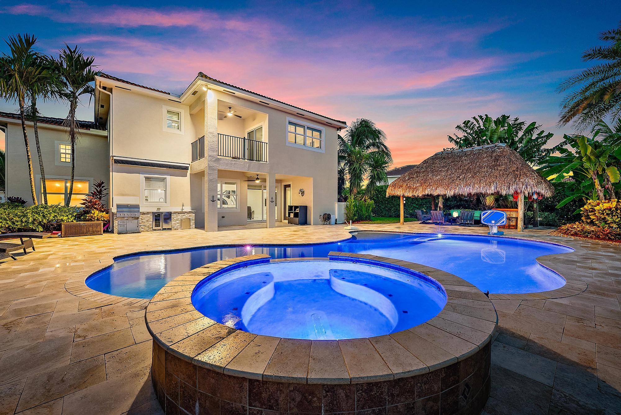 Nestled within the prestigious gated community of Rialto, this elegant Valenti II model lakefront residence offers the perfect blend of luxury, comfort, and refined Florida living.
