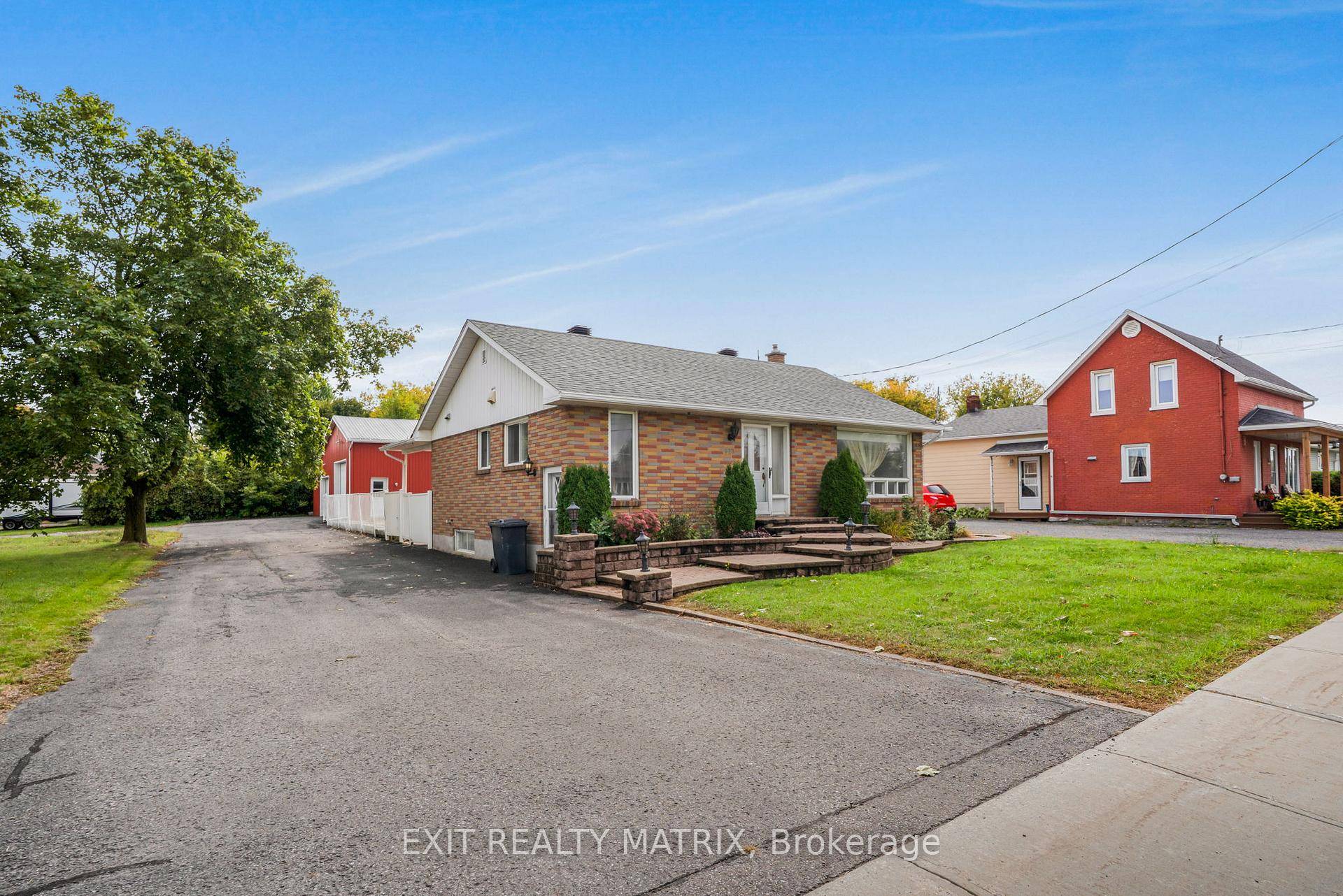 All Brick Bungalow with Heated Commercial Garage This well maintained all brick bungalow offers comfort and versatility in a prime location.