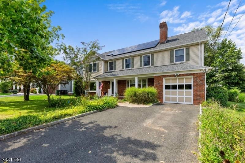 Expansive custom built brick front colonial with a beautiful backyard.