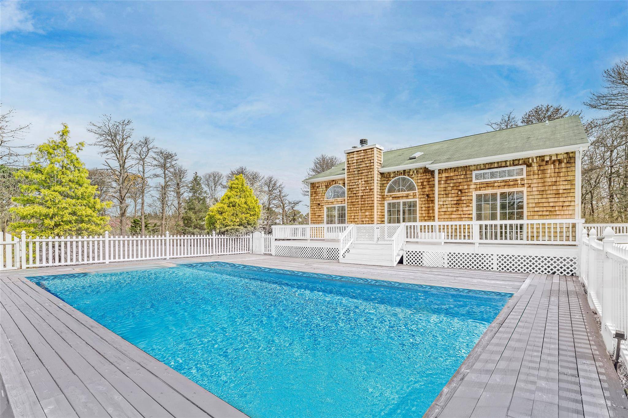 Tucked away at the end of a cul de sac, this light filled shingle style home offers the perfect blend of privacy, space, and effortless indoor outdoor living just 10 ...