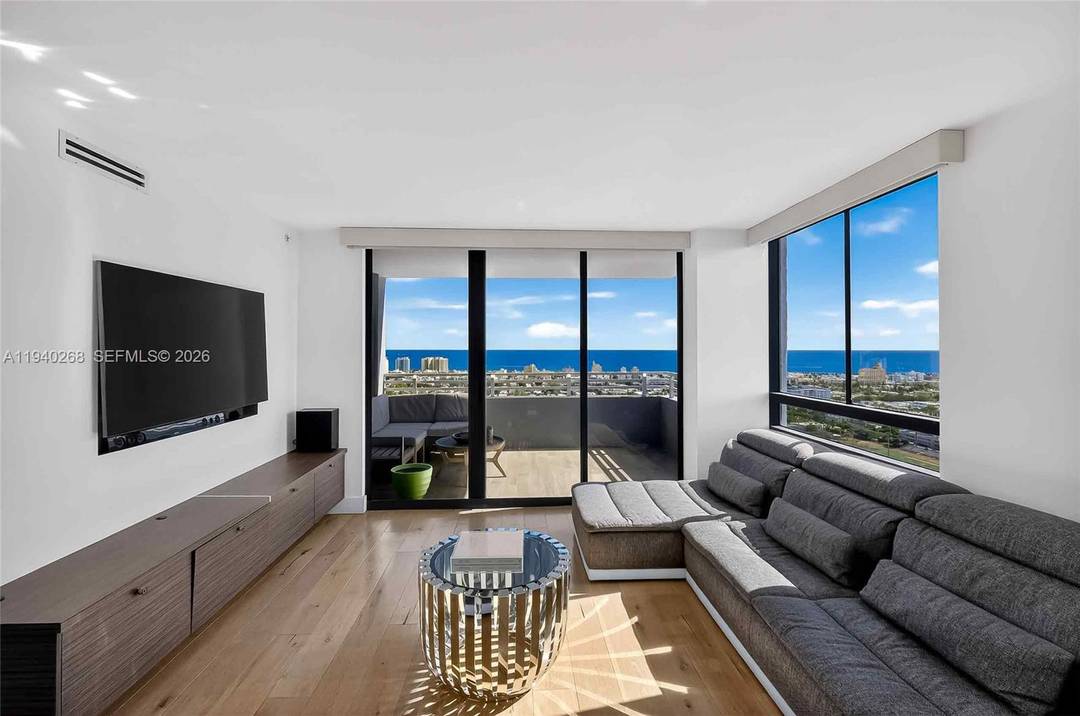 Wake up to sweeping views of the ocean and the Miami Beach skyline from this sun filled corner residence in the heart of West Avenue.