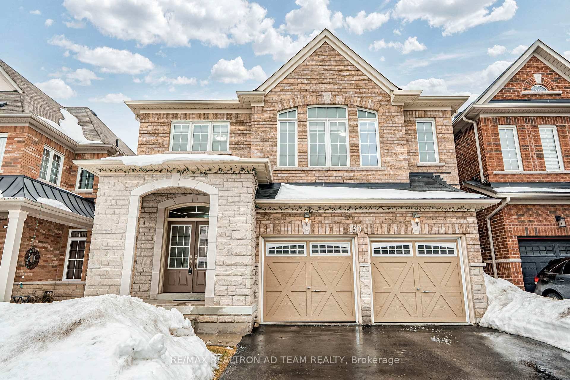 Welcome To This Beautifully Maintained Detached Home With A Double Car Garage And Stunning Stone And Brick Exterior !