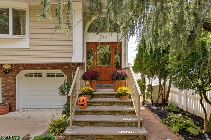 Welcome to this lovingly cared for 4 Bedroom, 2 Bathroom Bi Level home tucked away on a peaceful, tree lined street in the heart of Elmwood Park.