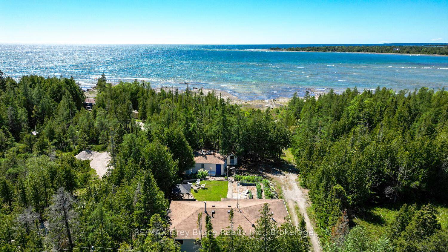Ahh... the sunsets... Soak in the breathtaking views along 100 feet of rocky Lake Huron shoreline, with a gentle entry to the water ideal for kids, pets, or launching your ...