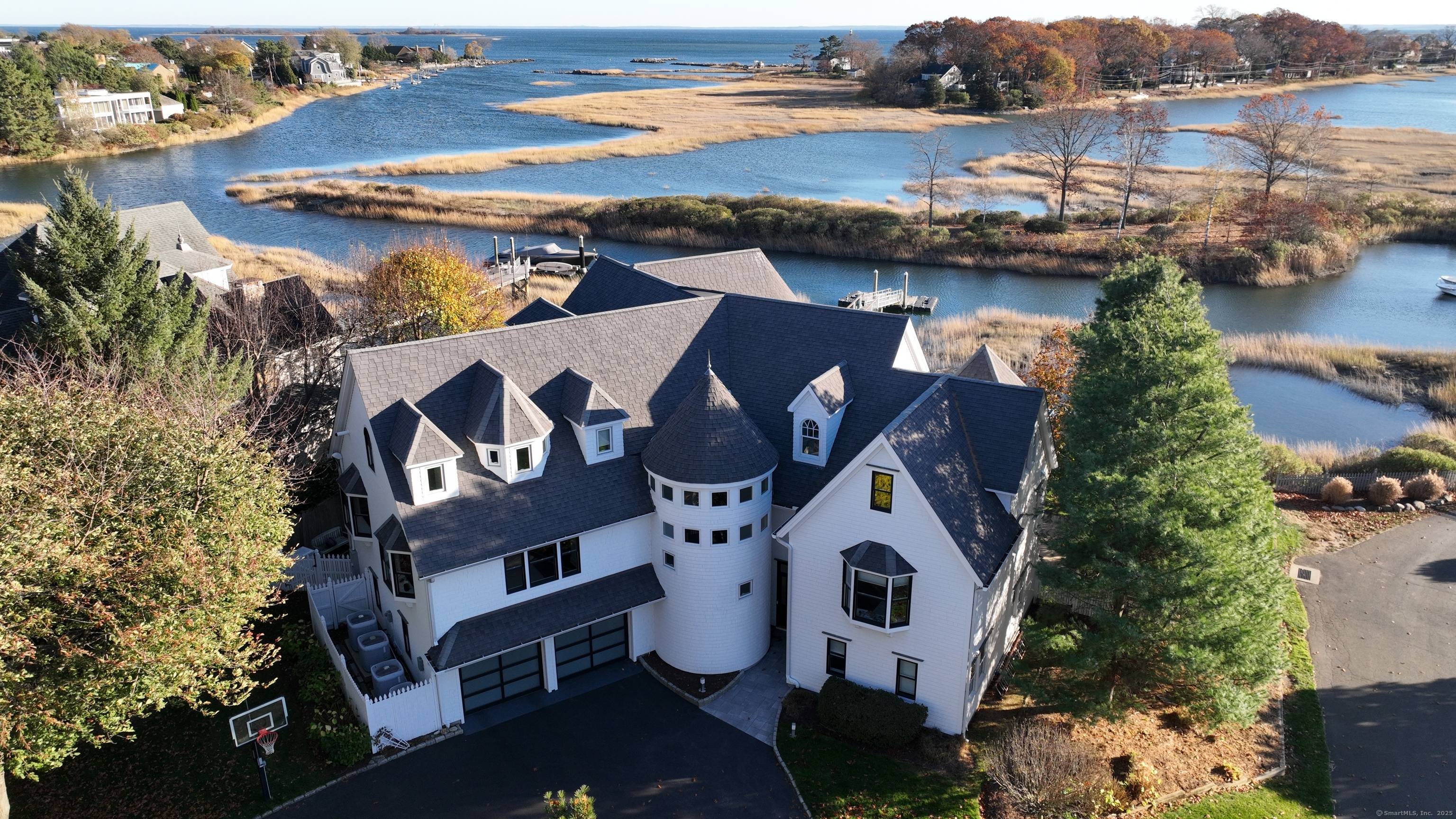 Welcome to Saugatuck Shores, an exceptional waterfront enclave offering unparalleled luxury and privacy.