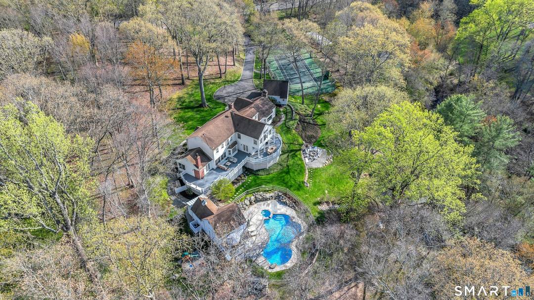 Welcome to 1541 Oenoke Ridge, a spectacular country retreat with unparalleled privacy and natural beauty.