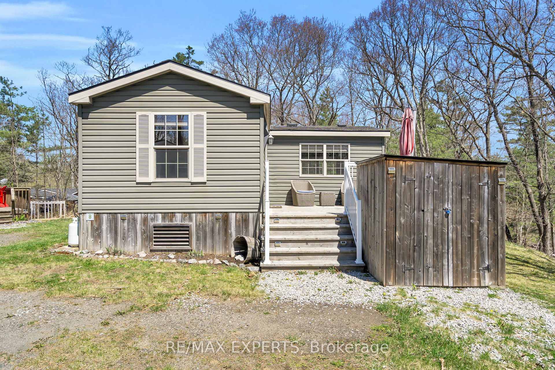 Welcome to 1336 South Morrison Lake Rd, Unit 8 a charming and ultra private seasonal getaway tucked beneath a canopy of majestic oak trees, set in the heart of Lantern ...