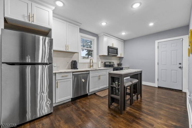 Spacious 4 bedroom, 2 bath home featuring a separate dining room, ample living space, and a finished attic for added versatility.