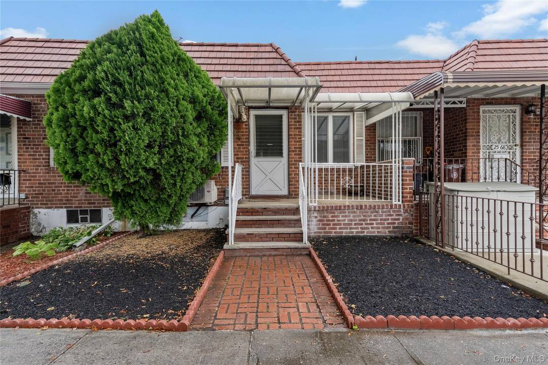 Well maintained attached all brick ranch home with a full above grade basement in the trendy Astoria, Queens neighborhood.
