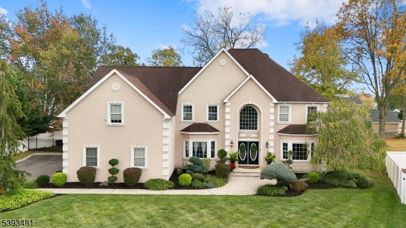Impressive custom 5 BR Colonial 3773 Sq Ft of living space situated on over a third acre lot.