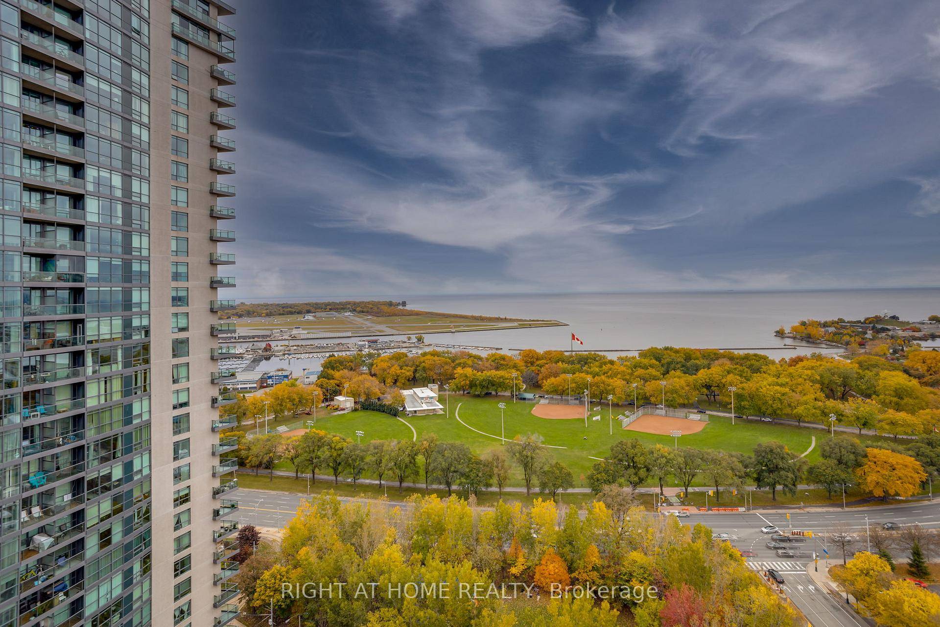 This Light Filled Spacious 2 Bdrm 2 Bath Den Suite W Wrap Around Flr To Ceiling Windows With Spectacular Panoramic Lake Views.