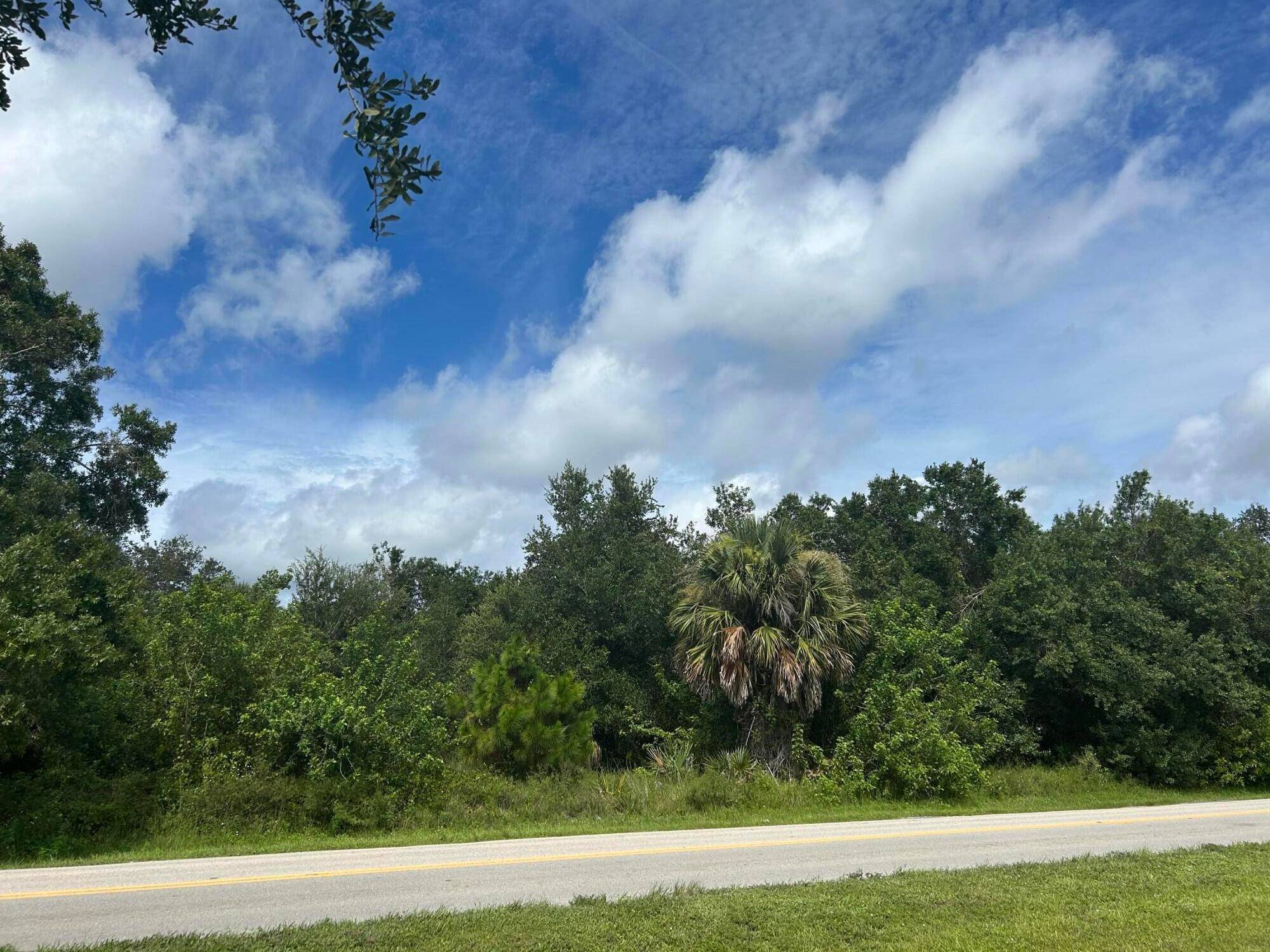 Excellent location, double lot on Vero Beach Estates right on a paved road.