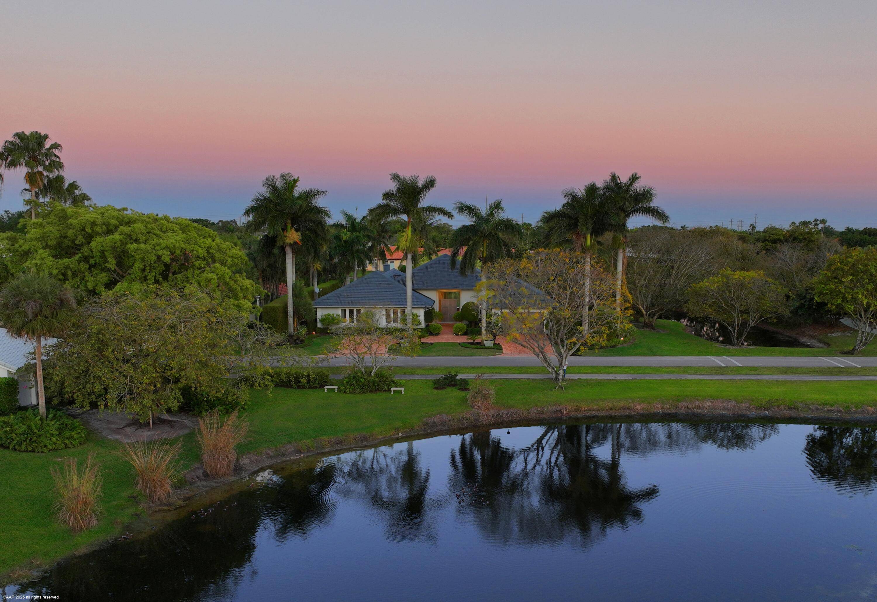Stunningly remodeled lakefront home with expansive water views in Palm Beach Polo.