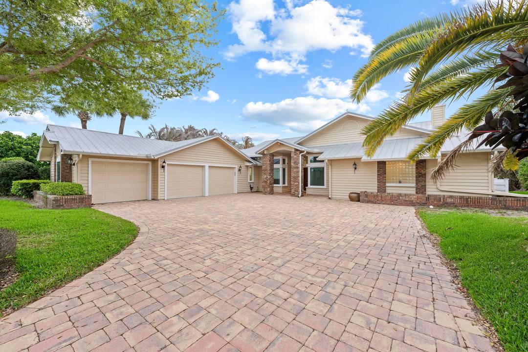 Stunning 4 bedroom, 3 bathroom waterfront home offering over 3, 200 sq ft of living space in a guard gated community.