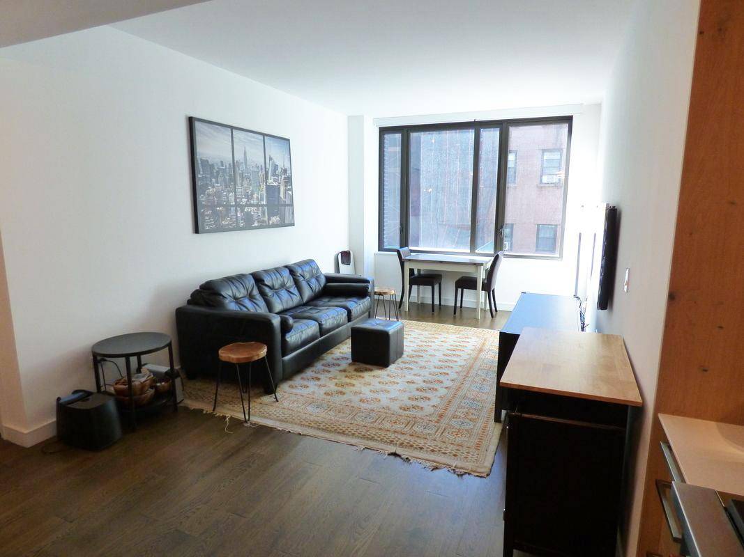 Spacious sun filled Junior 1 bedroom apartment at the ultra contemporary The Jefferson condominium.