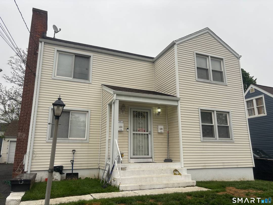 Welcome to this 2 Family Home with a large two car detached garage and ample parking in the private driveway.