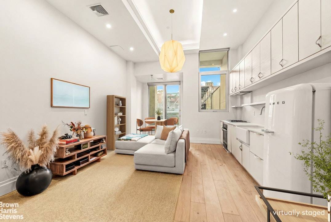 A striking, loft like one bedroom residence in a boutique luxury condominium with a pool, perfectly positioned at the crossroads of NoHo, the East Village, and Nolita.