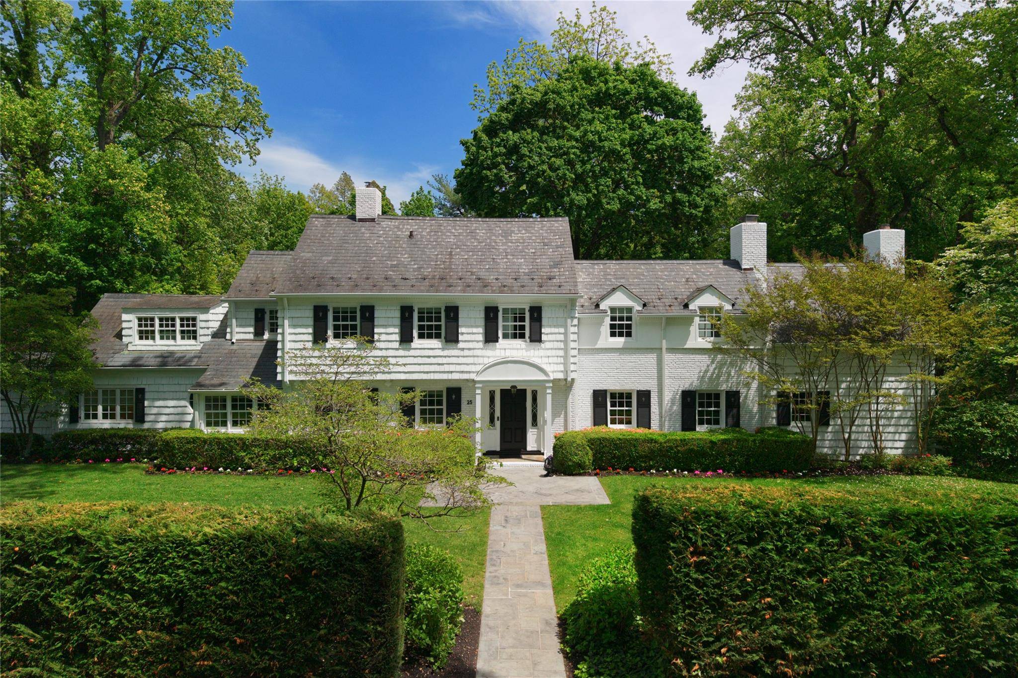 Tucked behind manicured hedges on a prized.