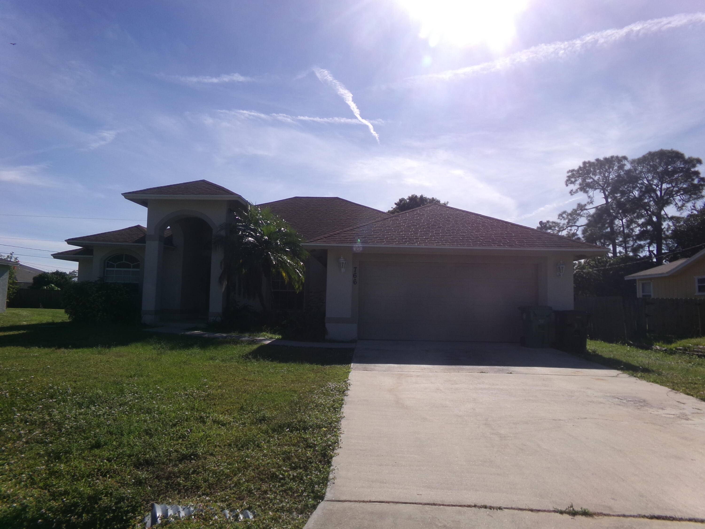 This freshly painted, four bedroom, two bathroom home is a spacious oasis.