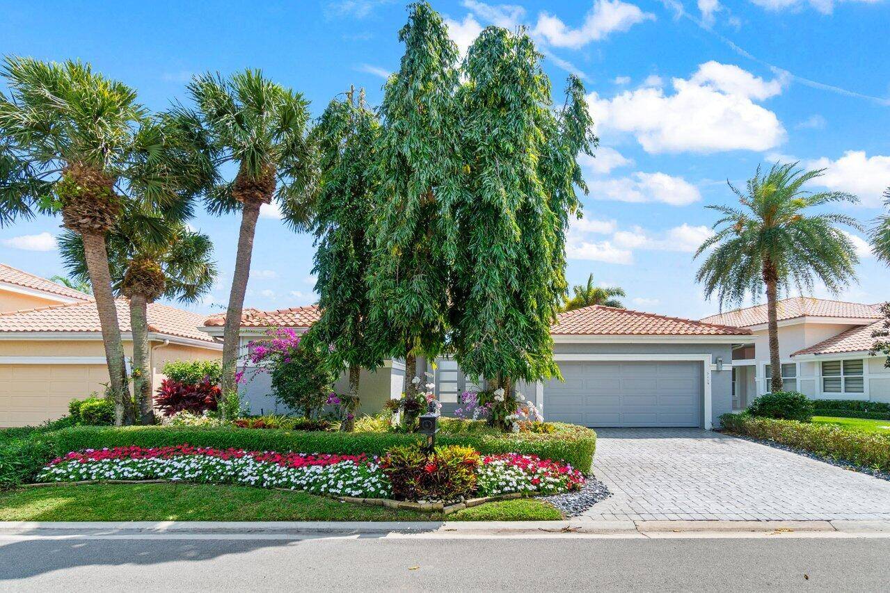 Experience luxury living in this beautifully renovated courtyard home with a private pool, offering breathtaking lake and golf course views.