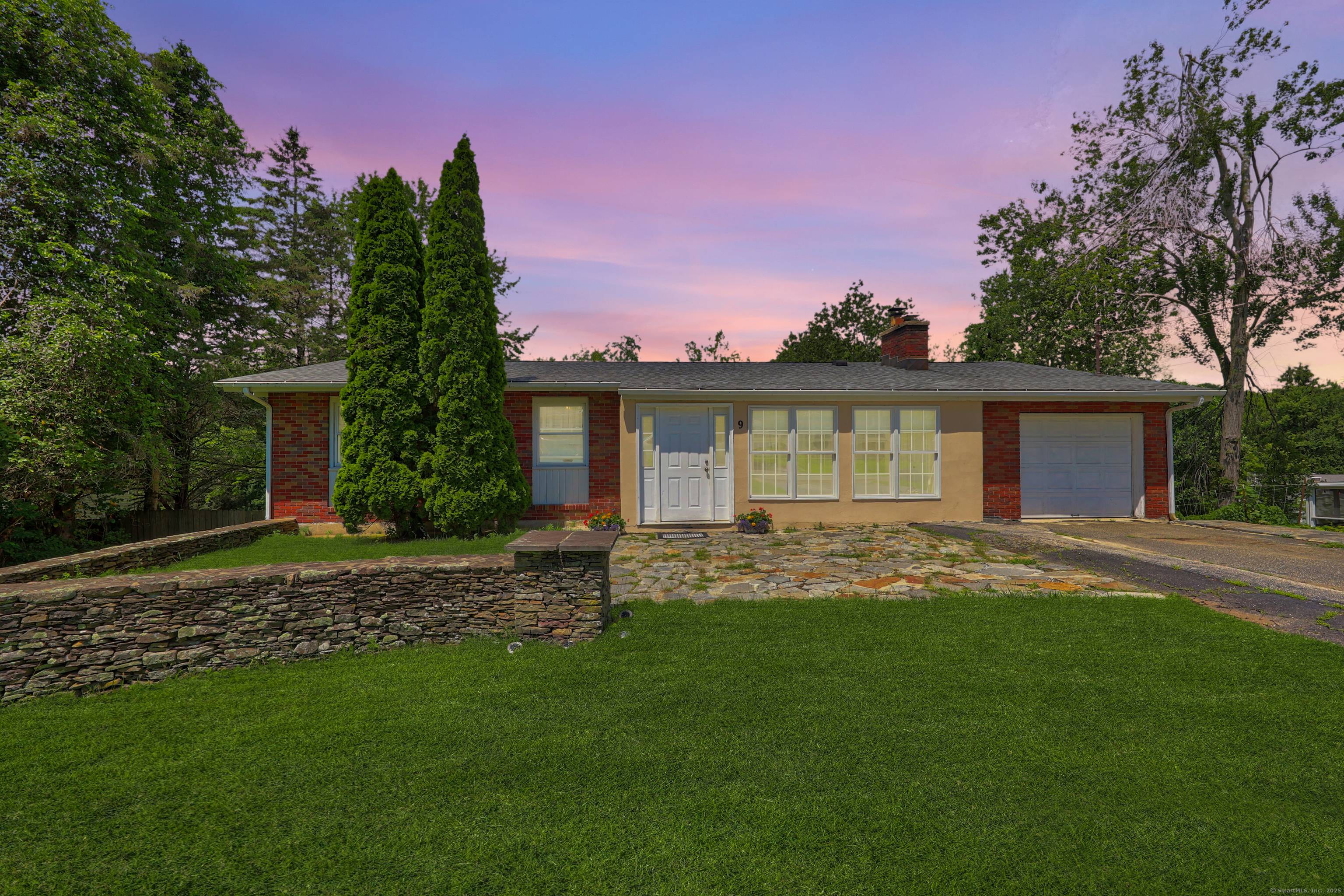 Welcome to 9 Corrine Drive, a spacious and versatile home nestled in the desirable town of Prospect, CT.