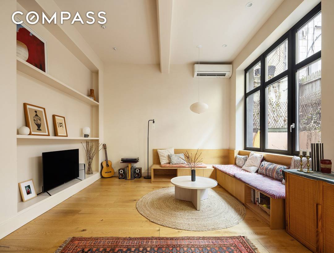 Welcome to 1F a stunning 1, 246 sqft duplex loft tucked inside a converted former cheesecake factory in the heart of Williamsburg.