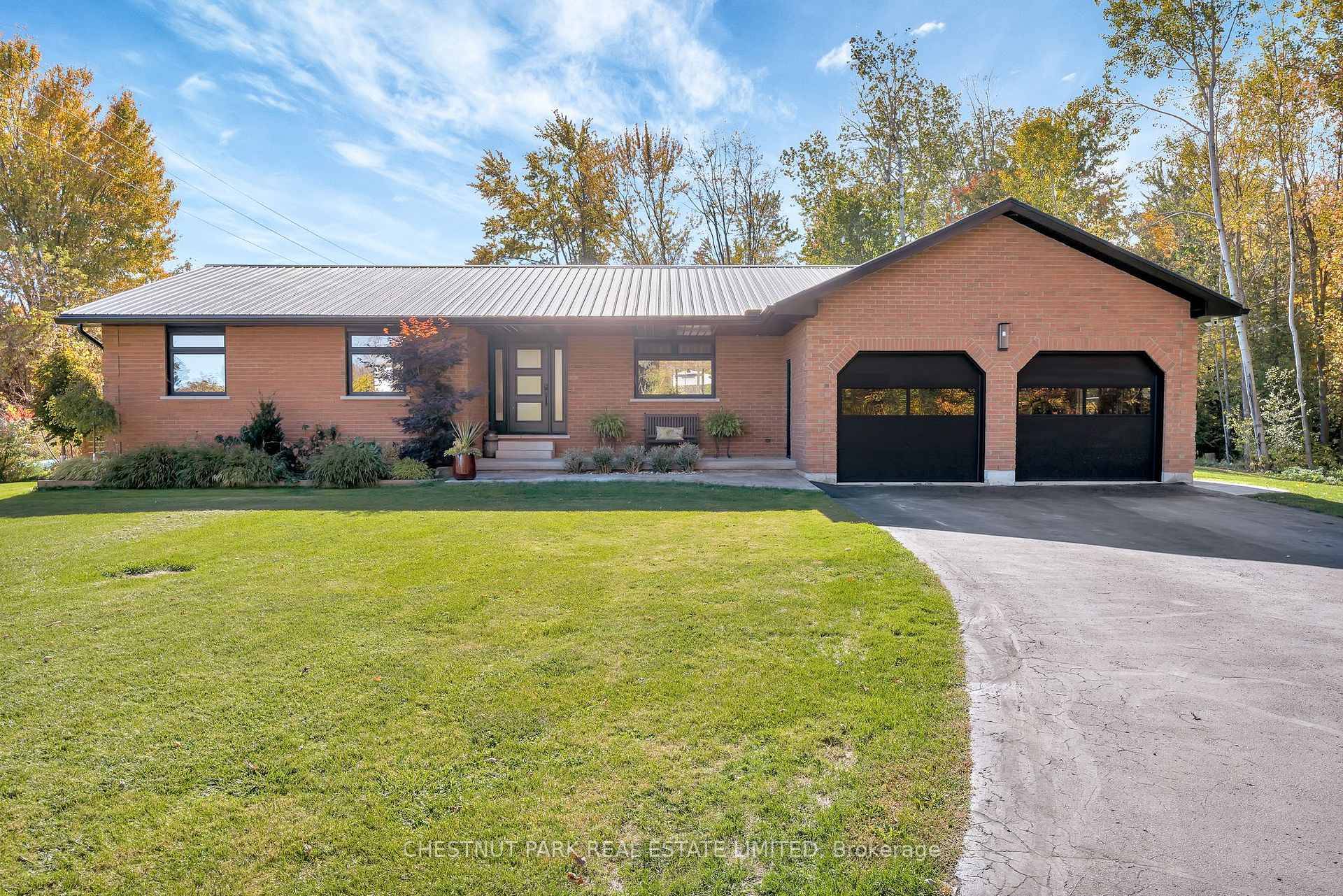Discreetly set back from the road and enveloped by green space, this masterfully reimagined residence offers over 1, 800 SQ FT of sophisticated single level living, meticulously renovated with both ...